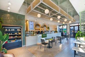 Sphere Design and Architecture Retail Food and Beverage Interiors Catia's Petite Ballito coffee shop bulkhead with bulb pendants